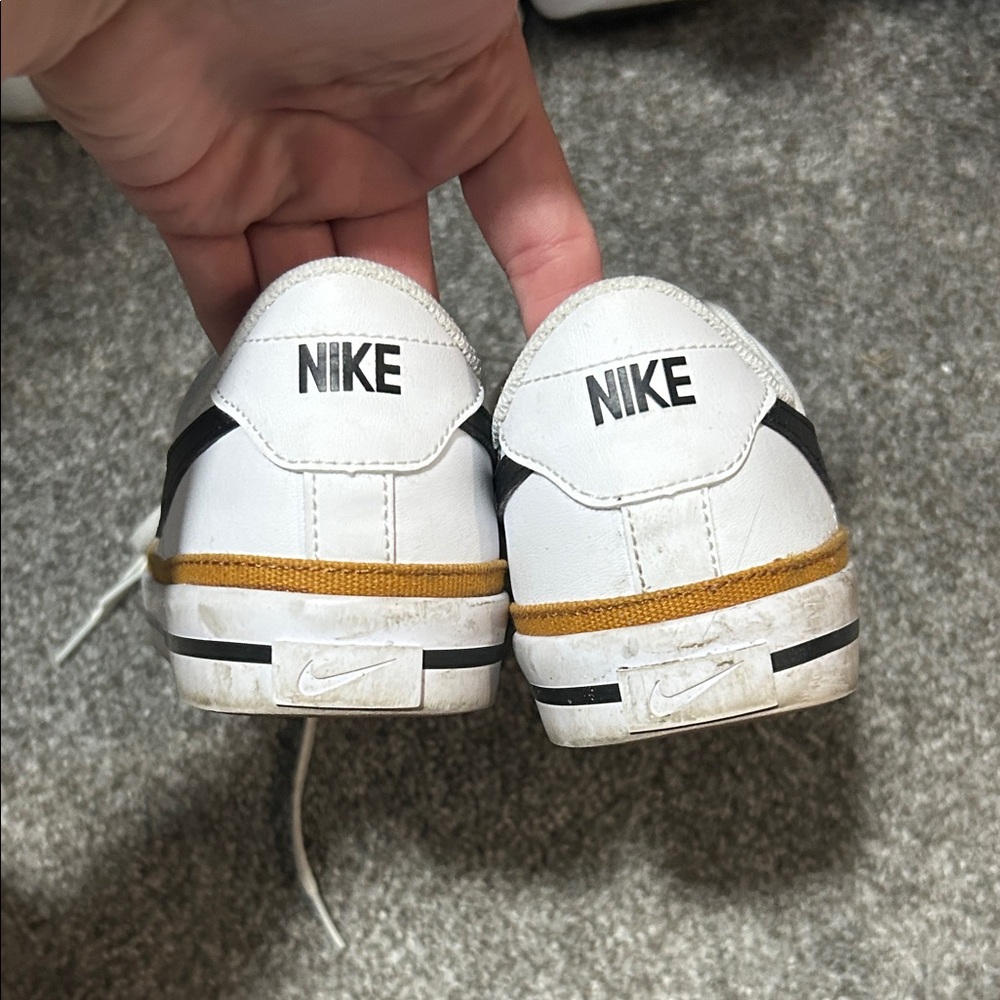 Nike Kids White Sneakers with Black Details and Gold Stripe
